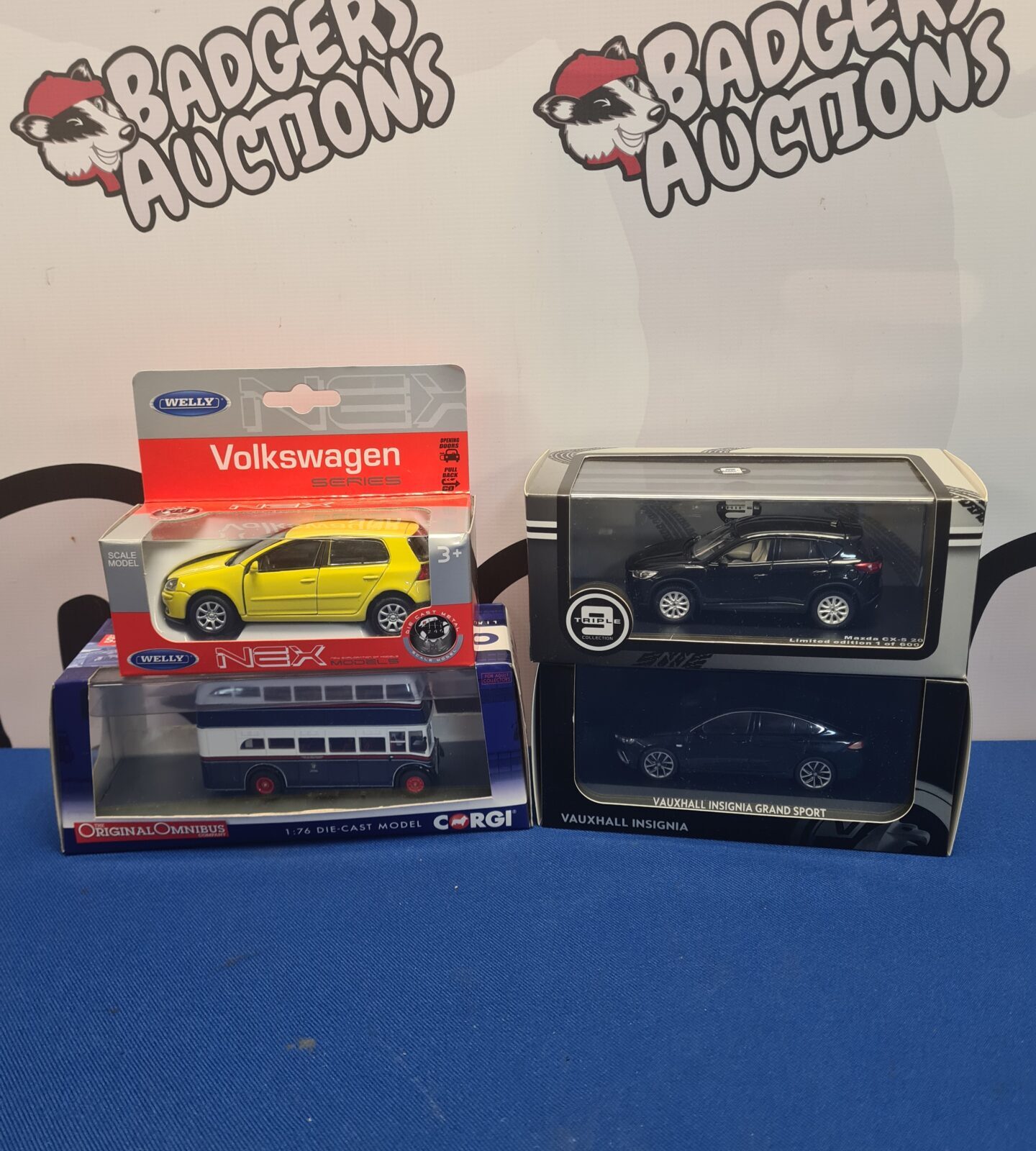 Boxed diecast model cars including a Corgi Volkswagen.