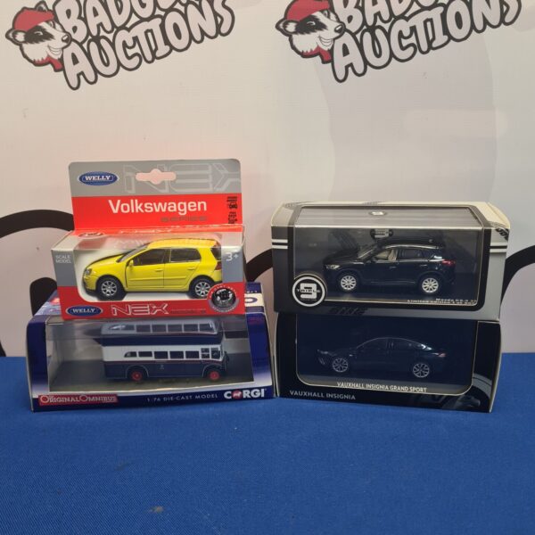 Boxed diecast model cars including a Corgi Volkswagen.