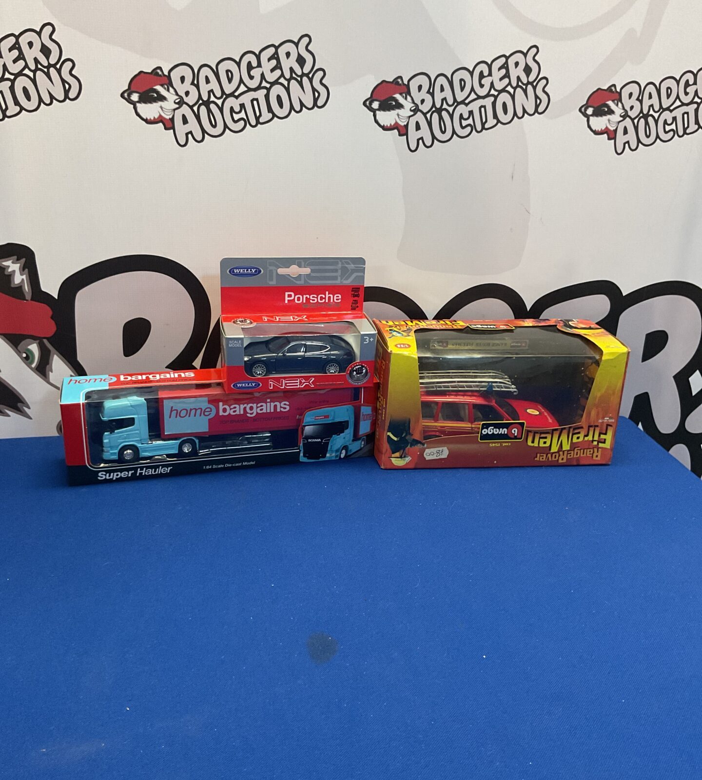 Boxed diecast model cars from Welly and Burago, collectible toy cars.
