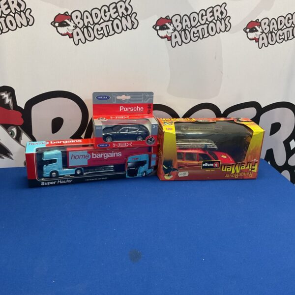 Boxed diecast model cars from Welly and Burago, collectible toy cars.