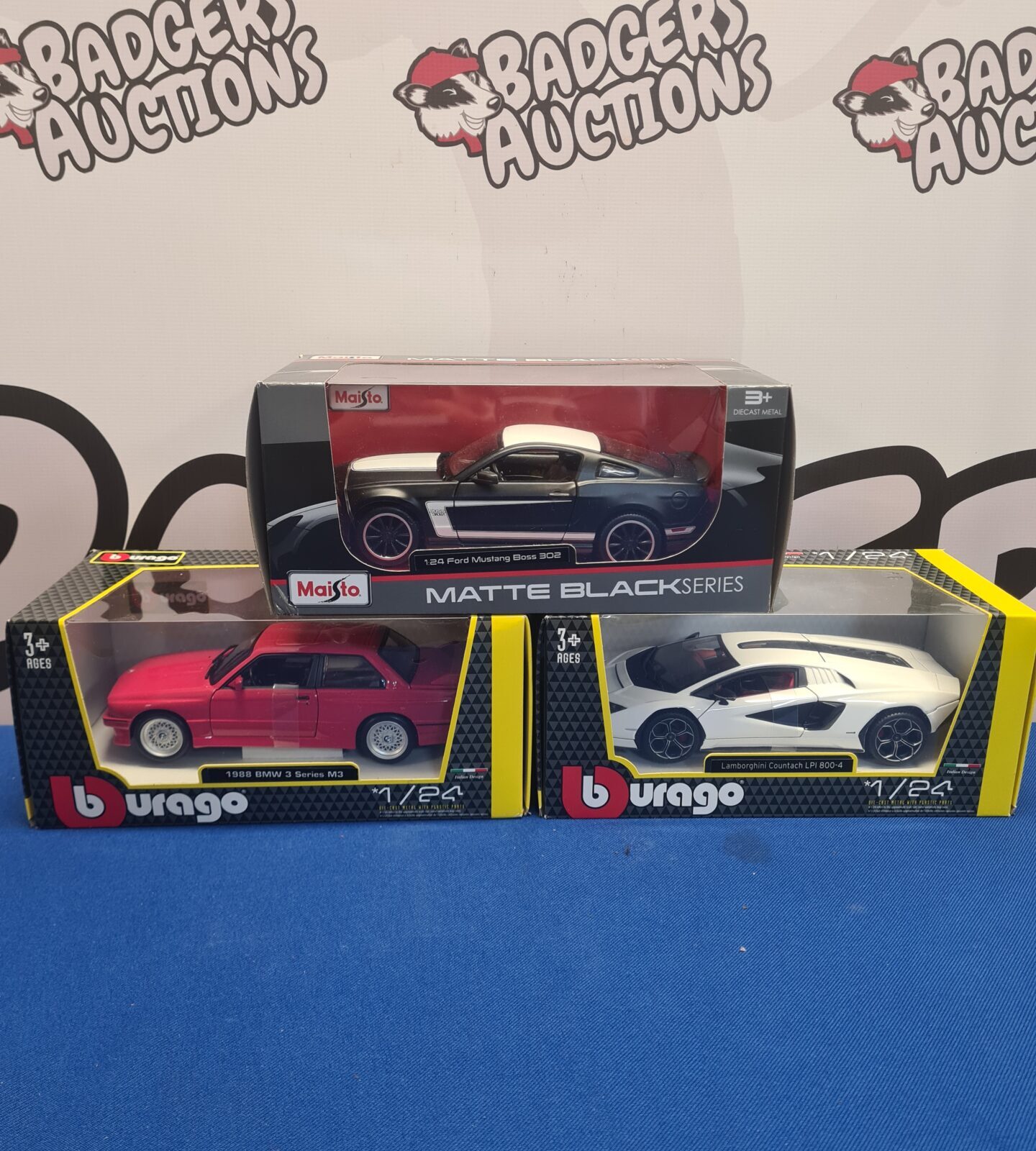 Boxed diecast model cars from Burago and Maisto in excellent condition.