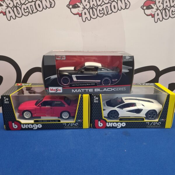 Boxed diecast model cars from Burago and Maisto in excellent condition.