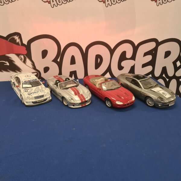 Selection of diecast model cars including Maisto models.