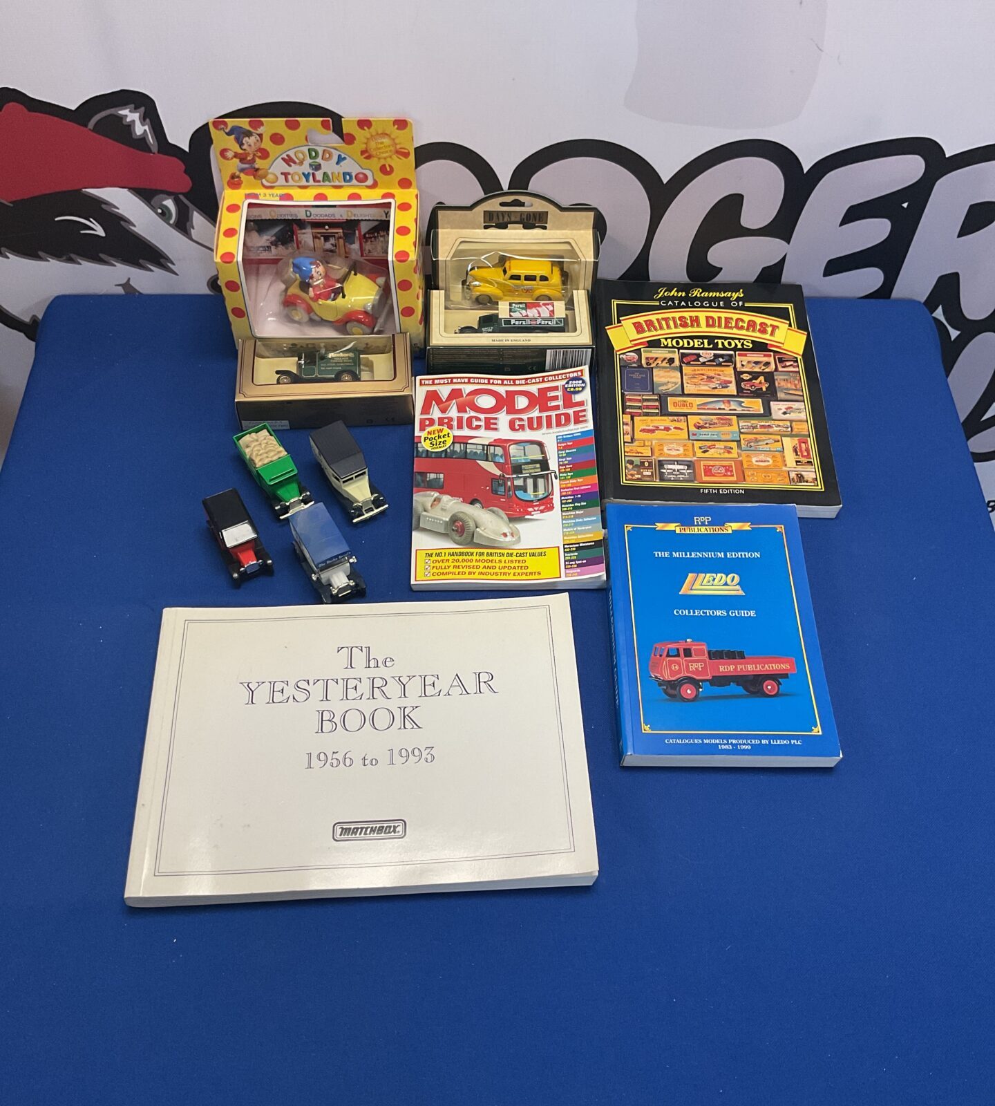 Diecast model collection with Lledo models and reference books.