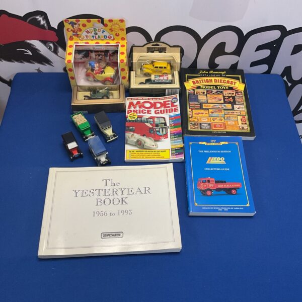 Diecast model collection with Lledo models and reference books.