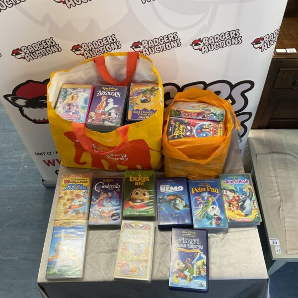 A lot of Disney VHS tapes in plastic bags.