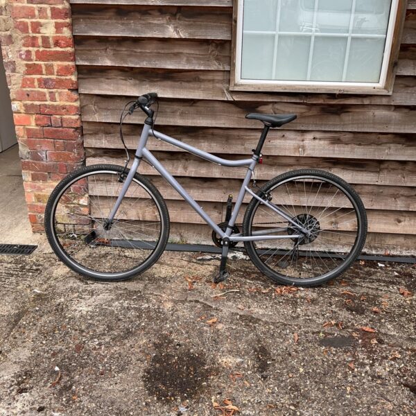 Silver DK hybrid bike for city commuting and leisure rides.
