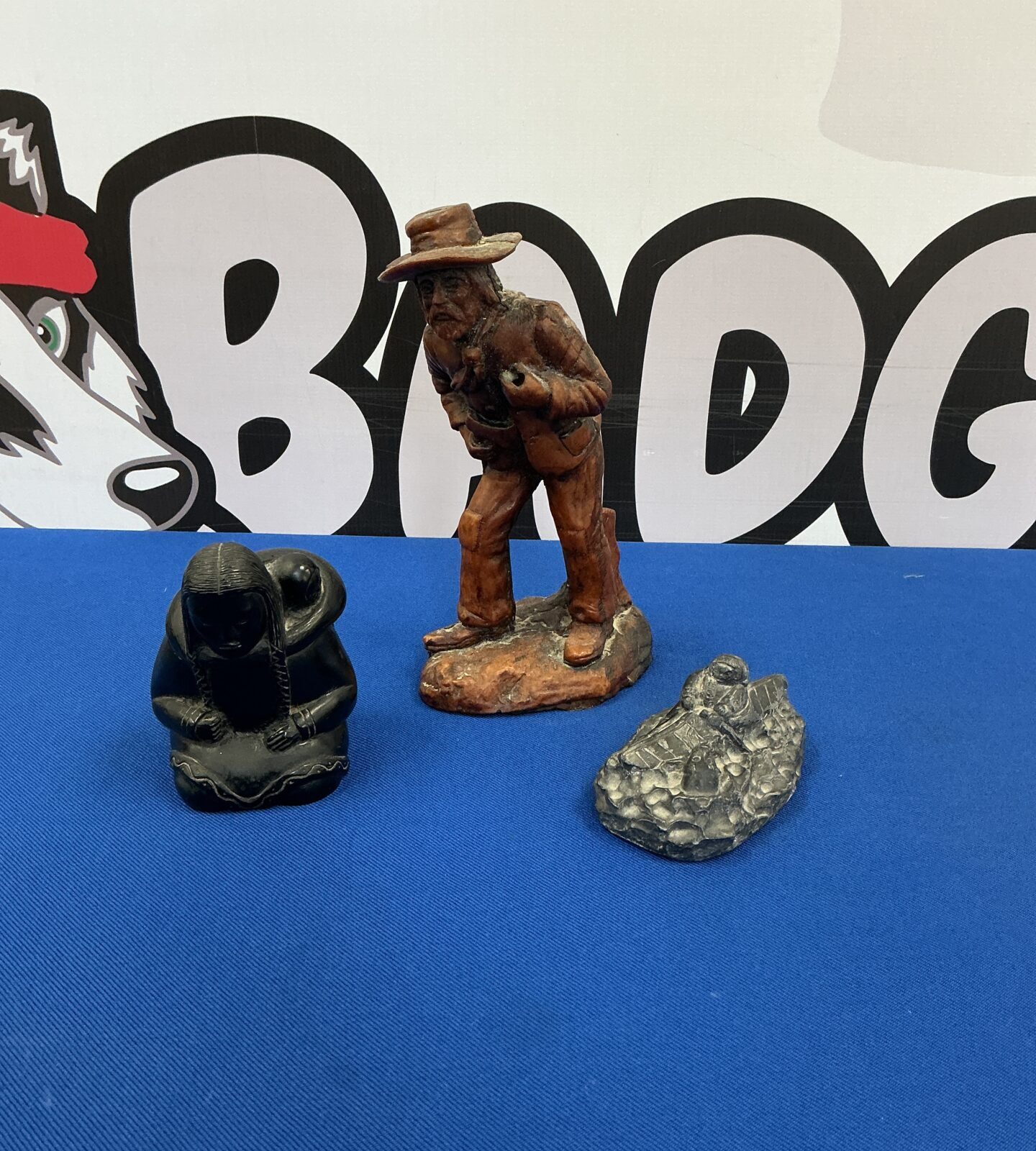 Vintage drunken cowboy figurine with Native American figure.