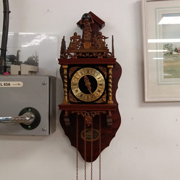Ornate antique Dutch Atlas Zaansk wall clock with pendulum.