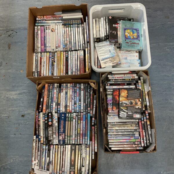 Large lot of assorted DVDs for home entertainment.
