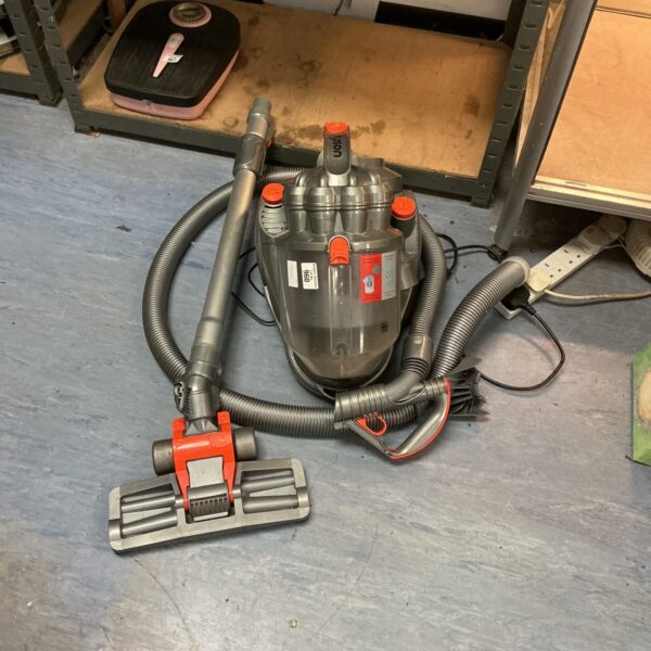 Used Dyson DC14 cylinder vacuum cleaner for home cleaning.