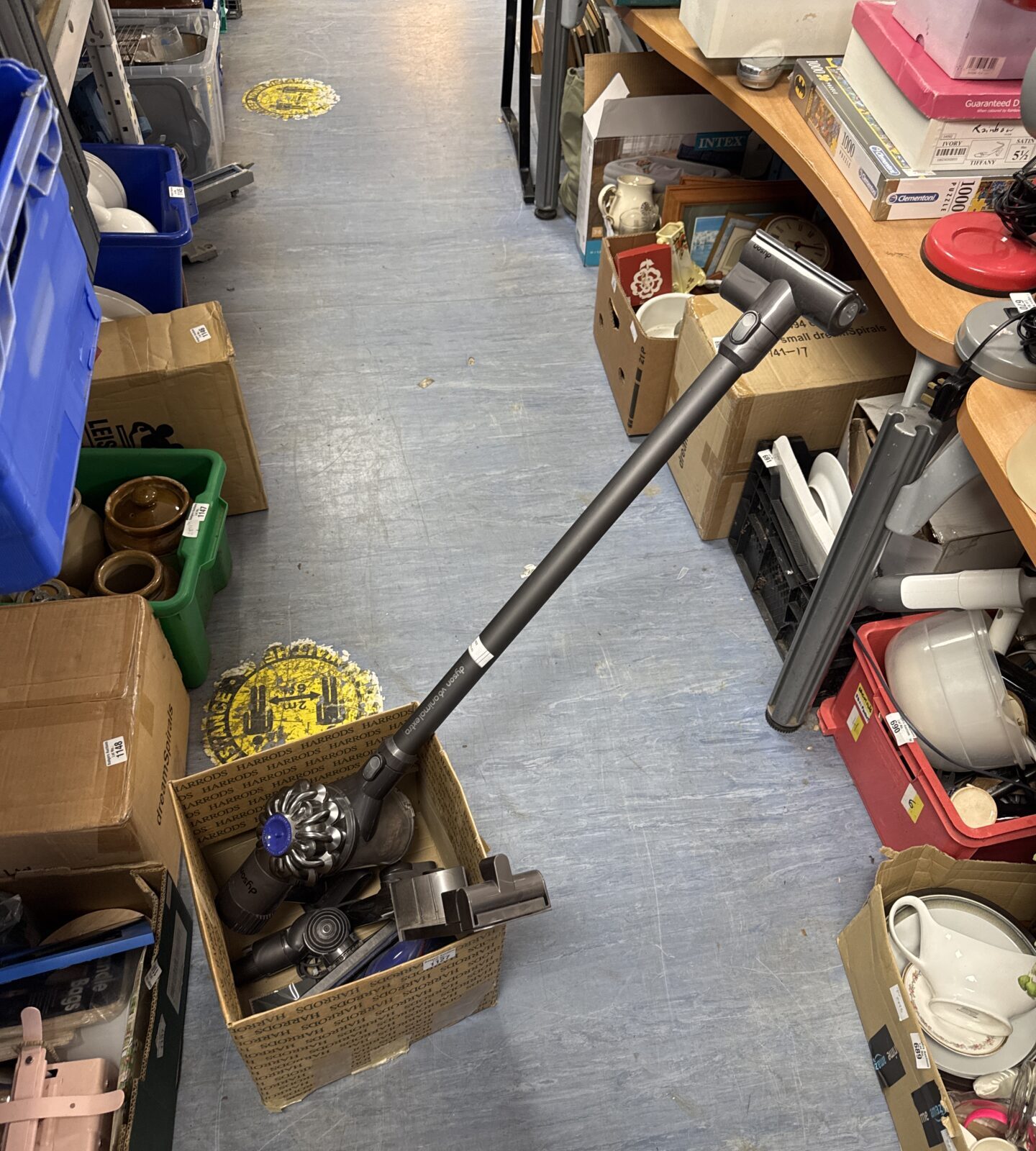 Dyson V6 Animal Extra cordless vacuum cleaner with accessories.