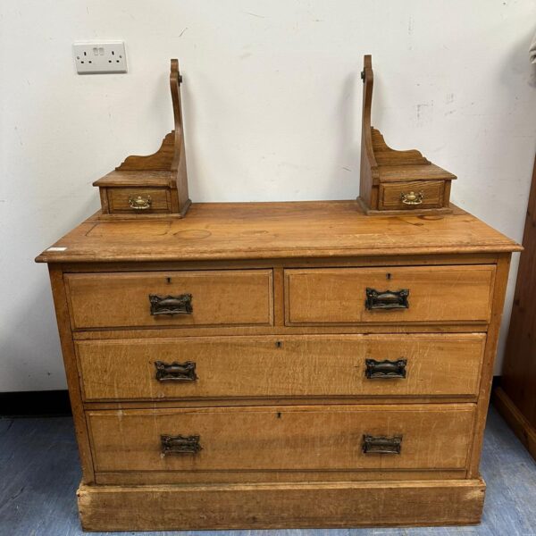 Antique oak dressing table with two over three drawers and mirror mounts.