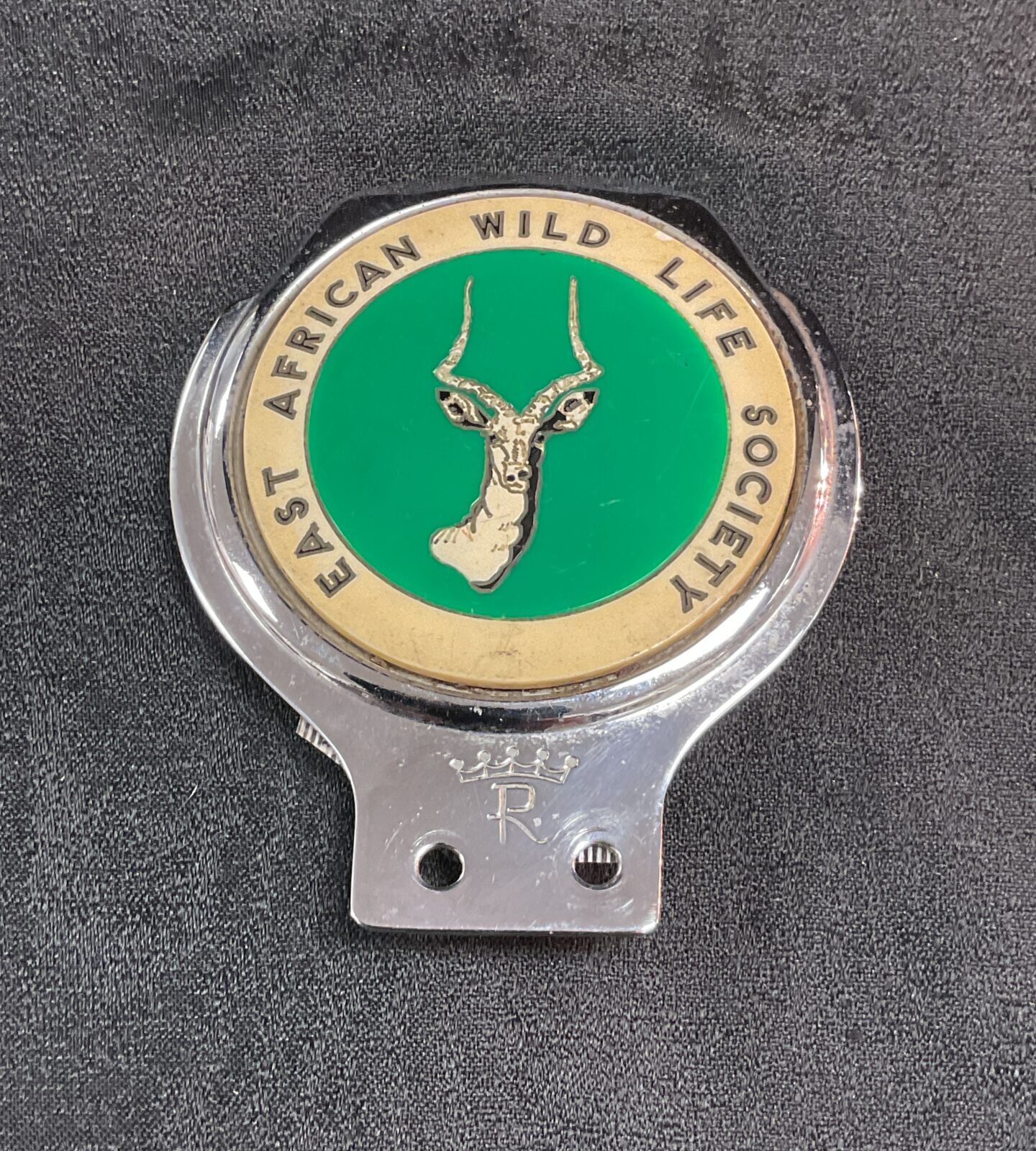 Vintage East African Wildlife Society Kudu grill badge for collectors.