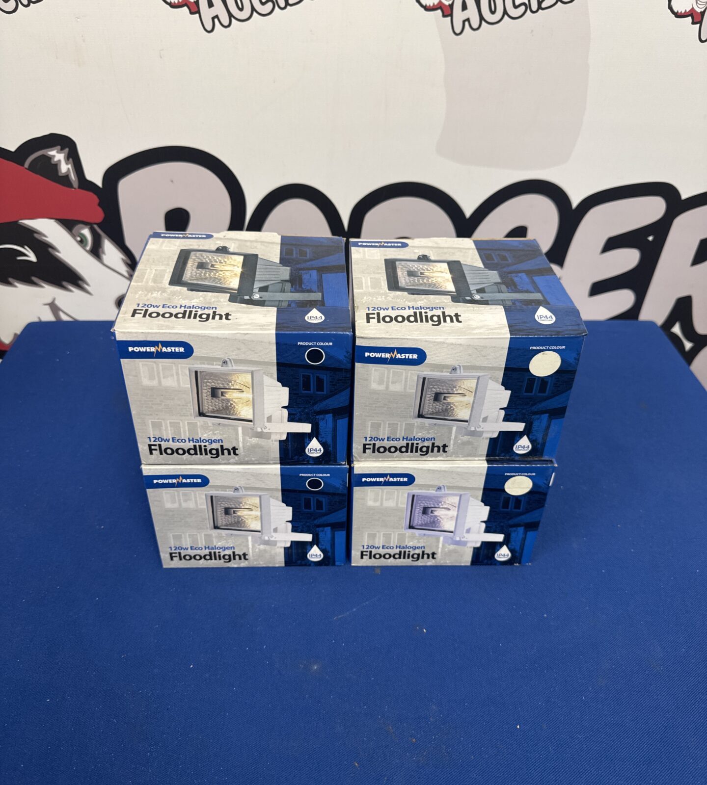 Lot of four Powermaster eco halogen floodlights in packaging.