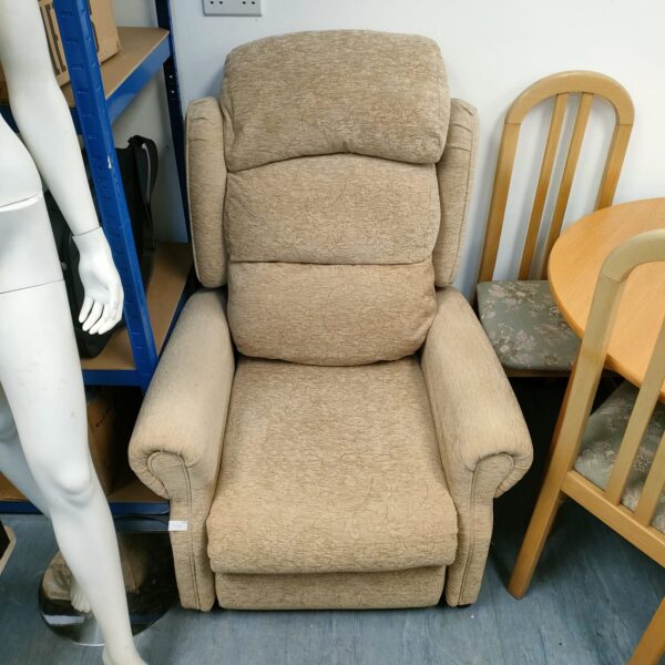 Beige electric recliner armchair with padded armrests.