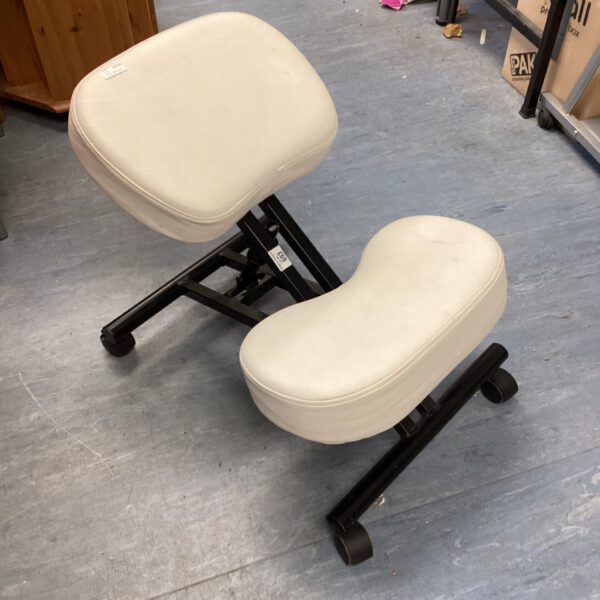 White ergonomic kneeling chair with adjustable height and padded supports.