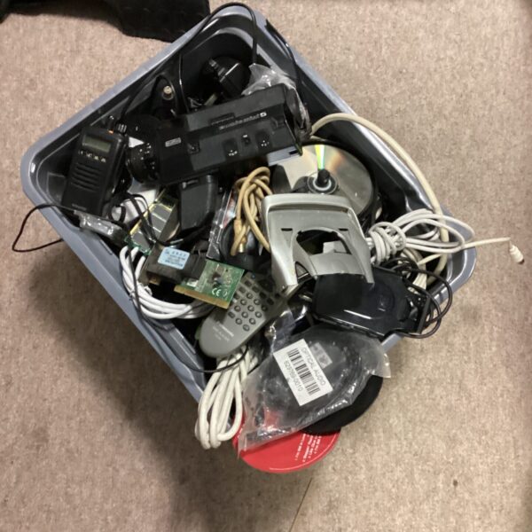 Vintage Eumig Super 8 camcorder with cables in a storage box.