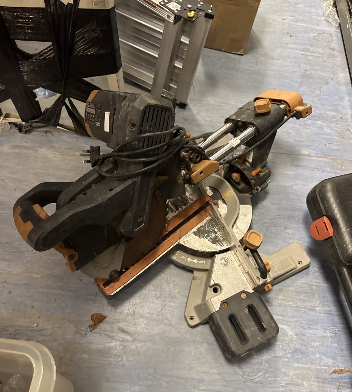 Evolution R255 chip saw in working condition, a portable power tool.