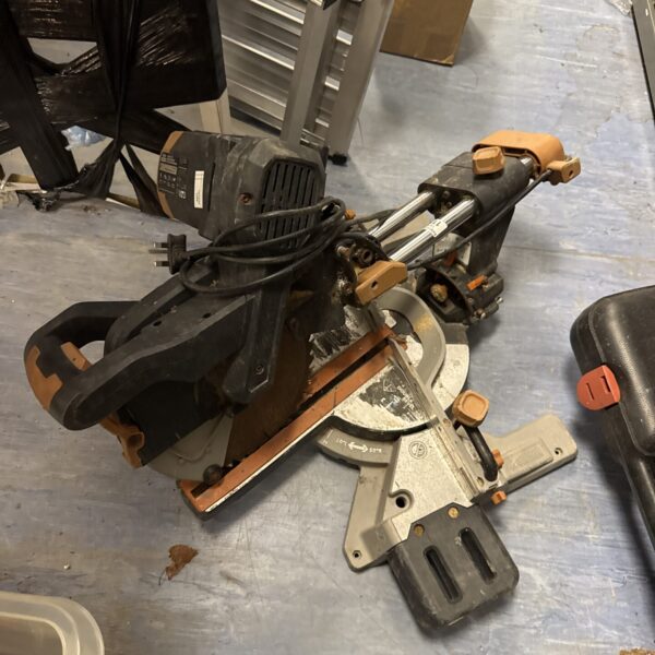 Evolution R255 chip saw in working condition, a portable power tool.