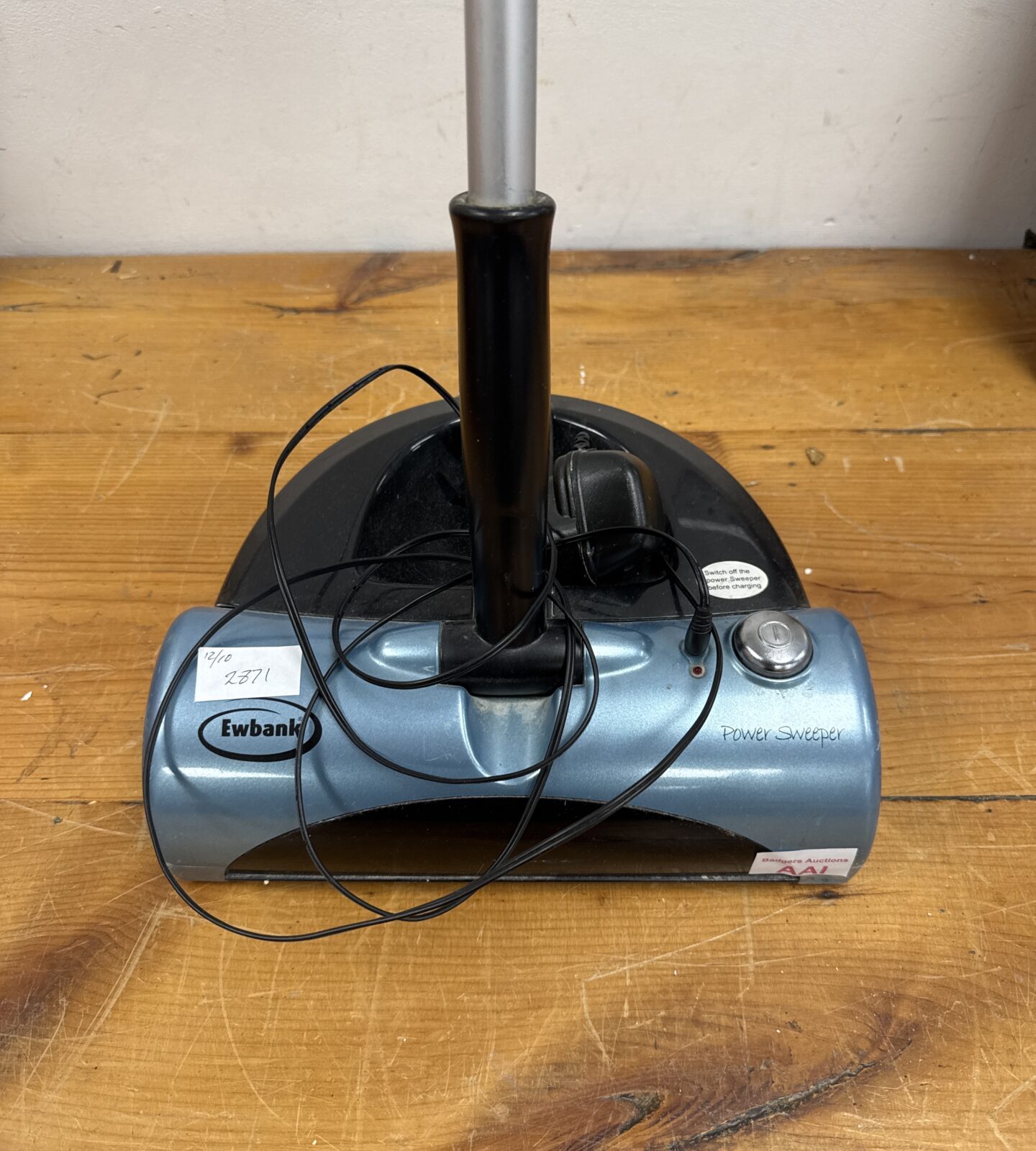 Close-up of the Ewbank power sweeper showing its design.