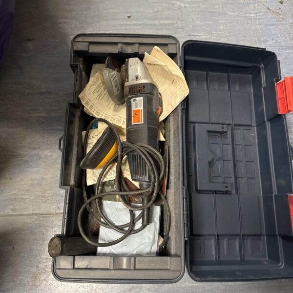 Vintage Felsetti angle grinder inside a plastic toolbox.