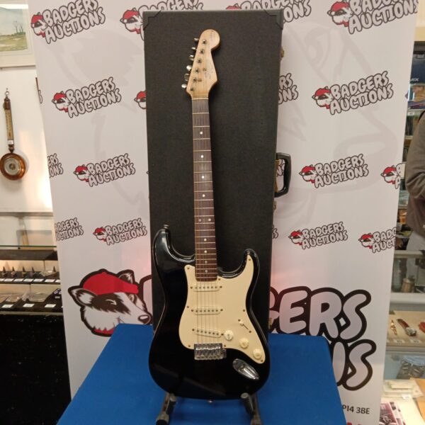 Black Fender Squire Bullet Series electric guitar with case.