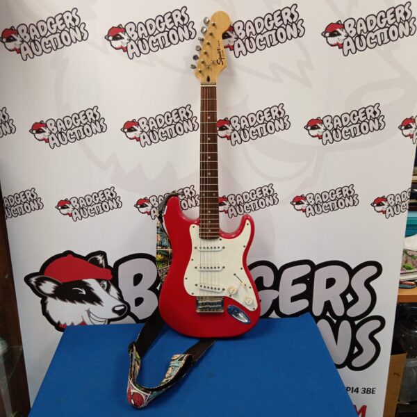 Red Fender Squire Mini electric guitar for beginners.