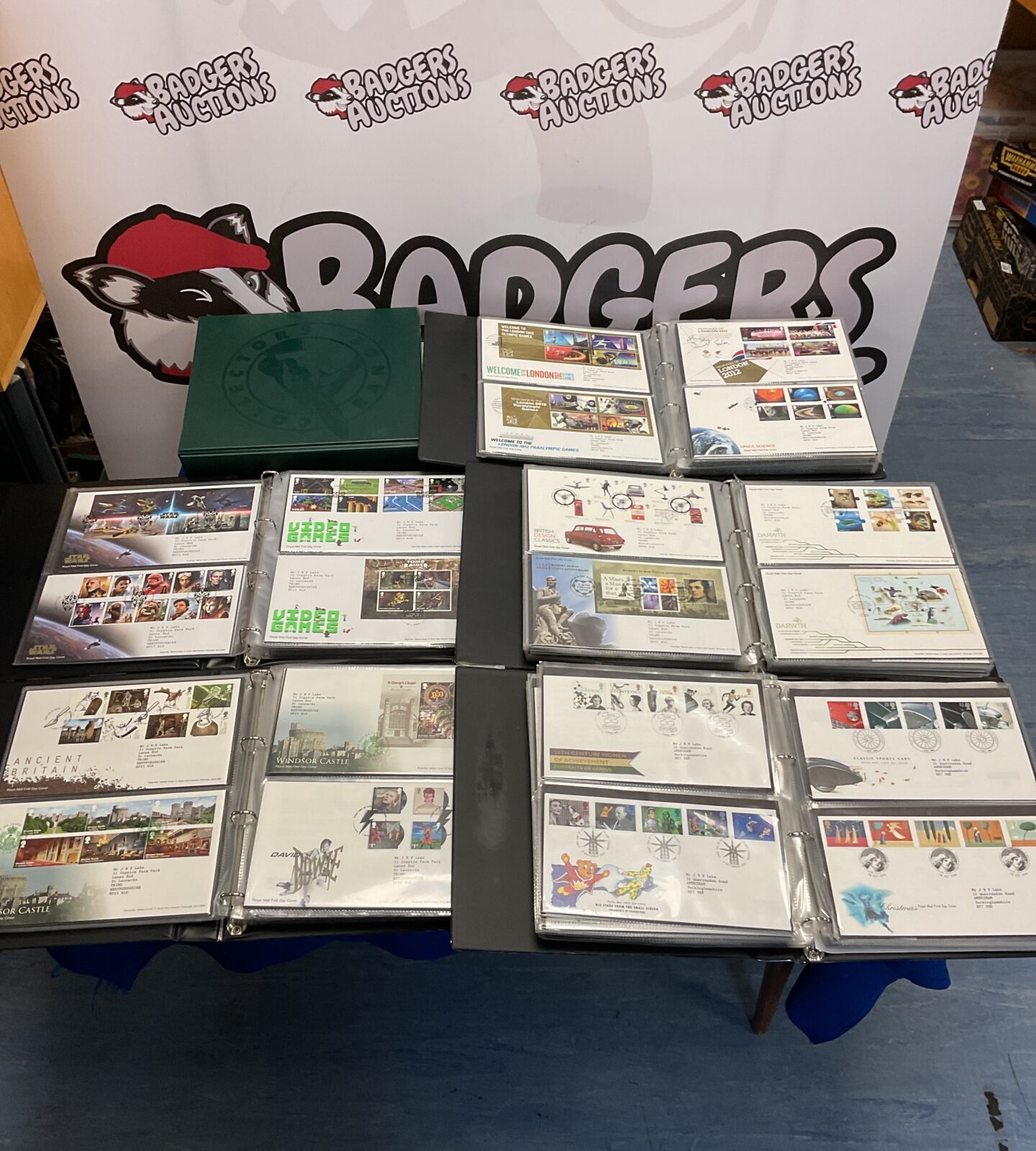 Overview of six albums filled with First Day Covers for stamp collectors.