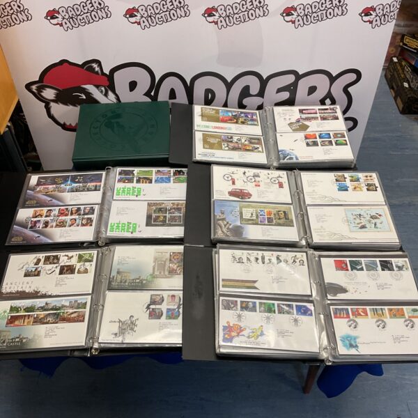 Overview of six albums filled with First Day Covers for stamp collectors.