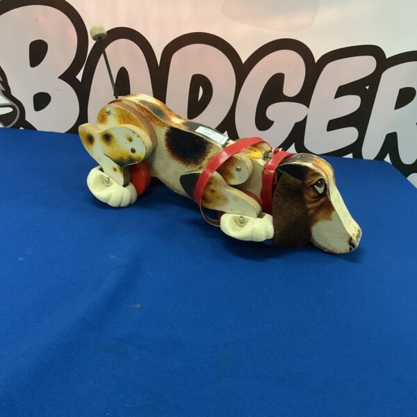 Vintage Fisher Price Snoopy walking dog toy, collectible 1970s.