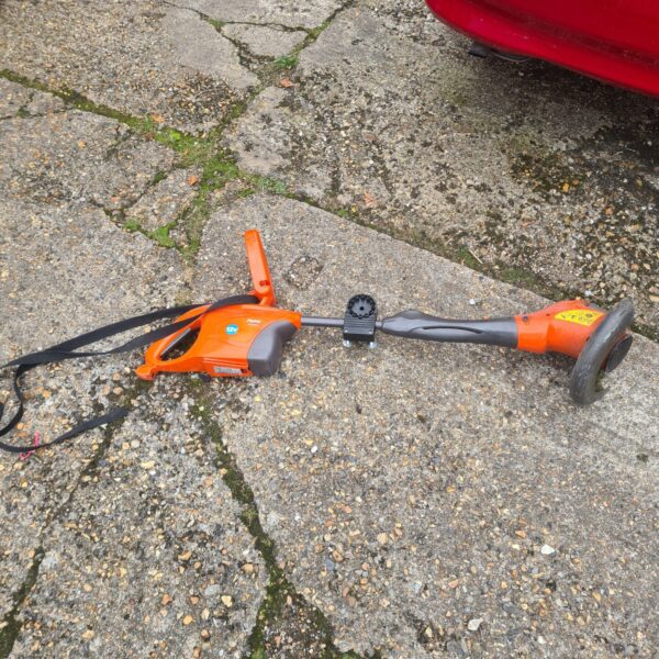 Used Flymo 12V Electrolux strimmer for garden maintenance.