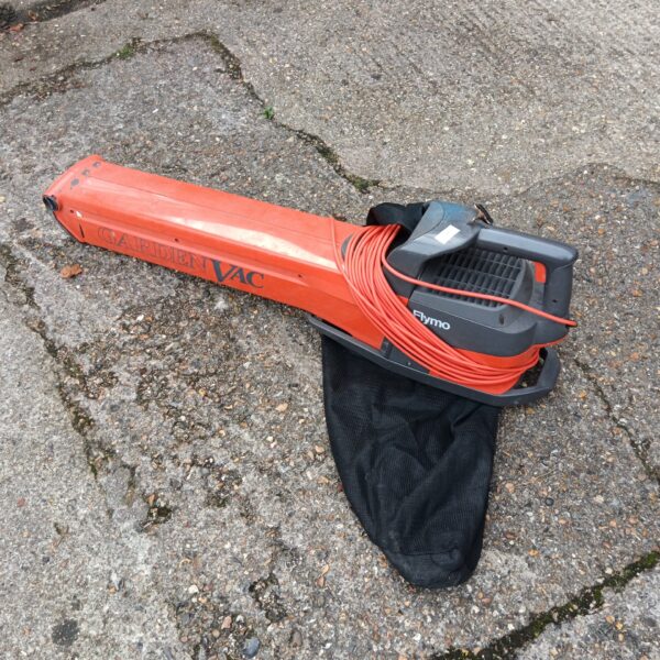 Used Flymo electric leaf blower and vacuum for garden cleaning.
