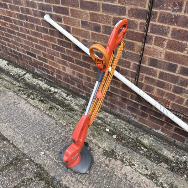 Flymo powertrim 500 electric strimmer for garden maintenance.