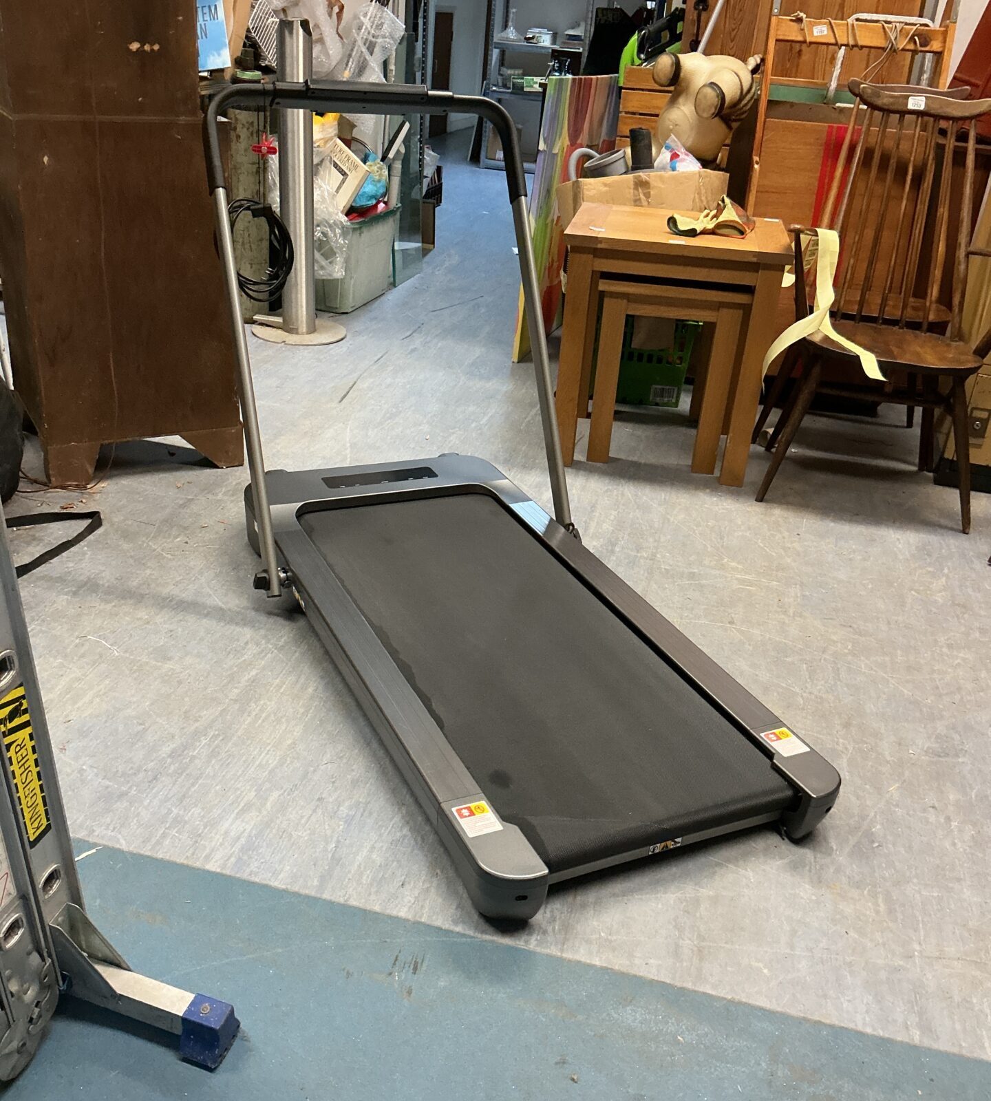 Compact folding treadmill for home cardio workouts and easy storage.