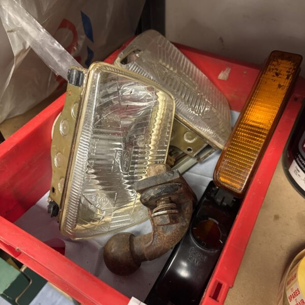 Tray of Ford Fiesta Mk1 parts for classic car restoration.