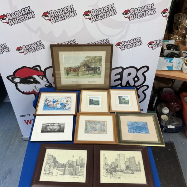 Selection of vintage framed prints for wall decor.