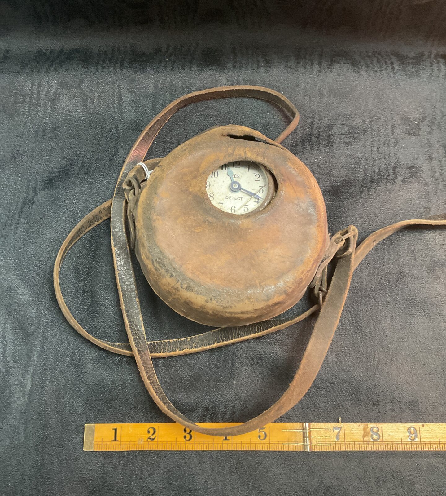 Vintage French night watchman's clock with protective casing.