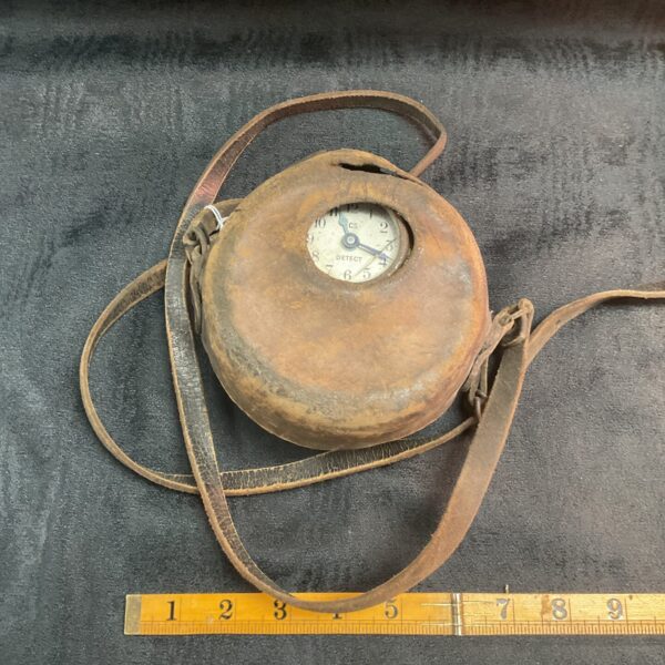 Vintage French night watchman's clock with protective casing.