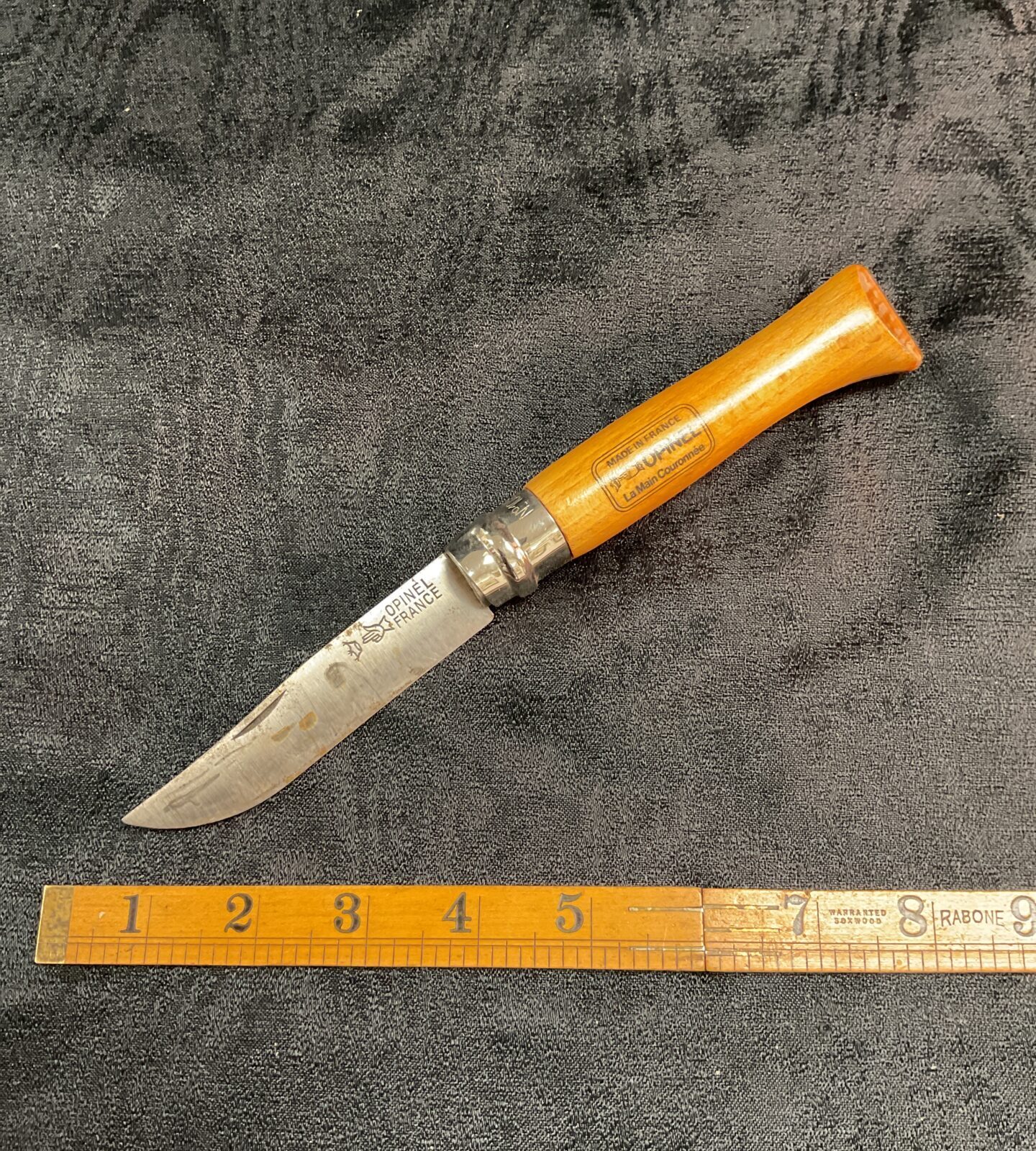 Vintage French Opinel pocket knife with wood handle.