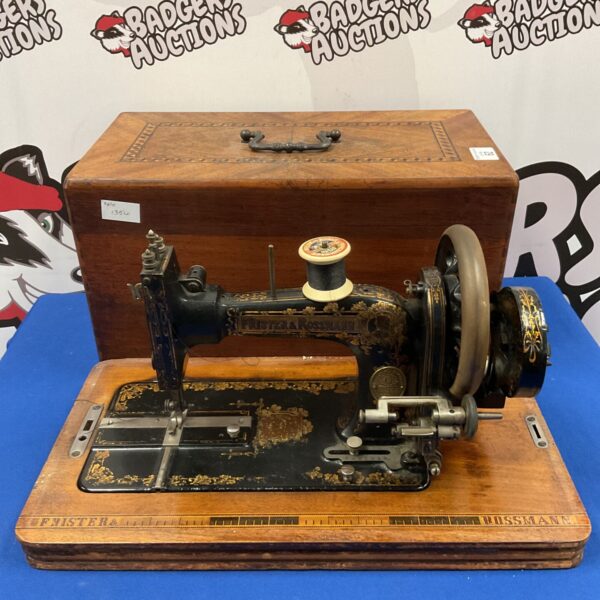 Antique Frister & Rossman hand crank sewing machine in good condition.
