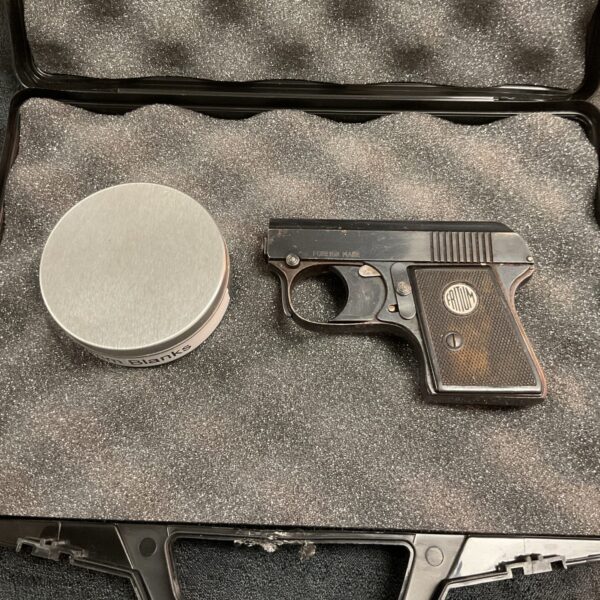 Vintage Fritum starting pistol displayed in its original case.