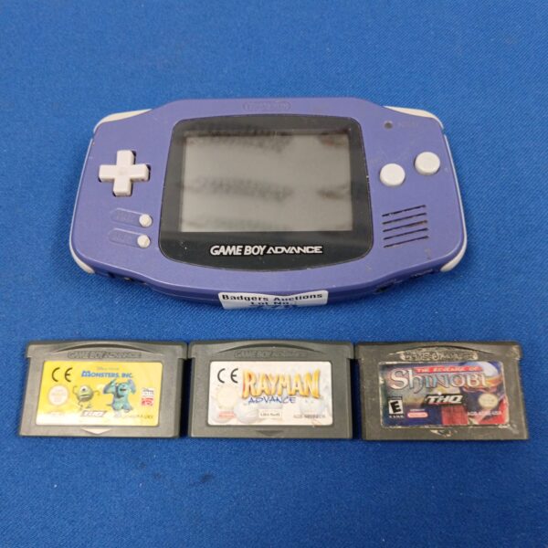 Purple Game Boy Advance console with three game cartridges.