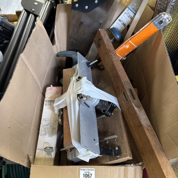 Mixed garage clearance lot with saws, drill and tools.