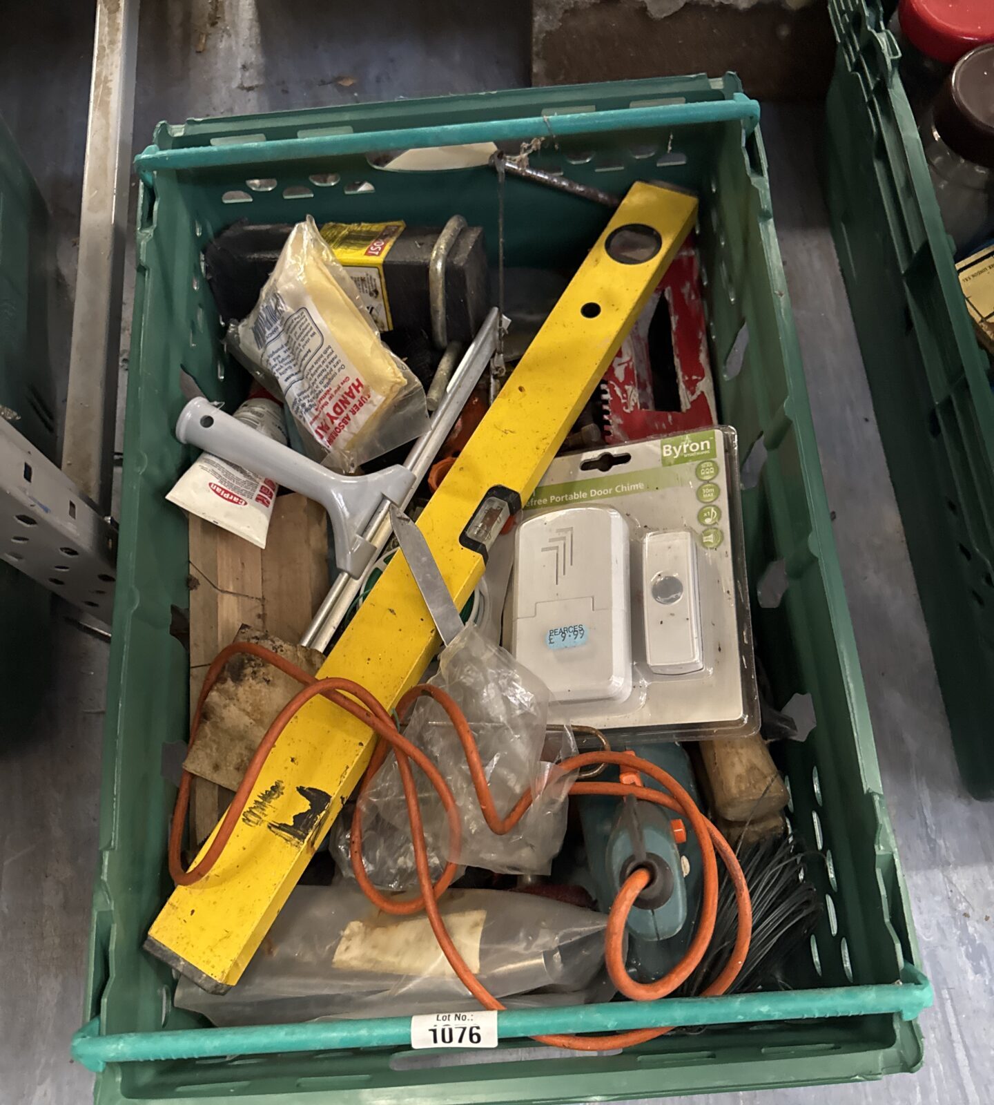Assorted tools and hardware in a garage clearance lot.