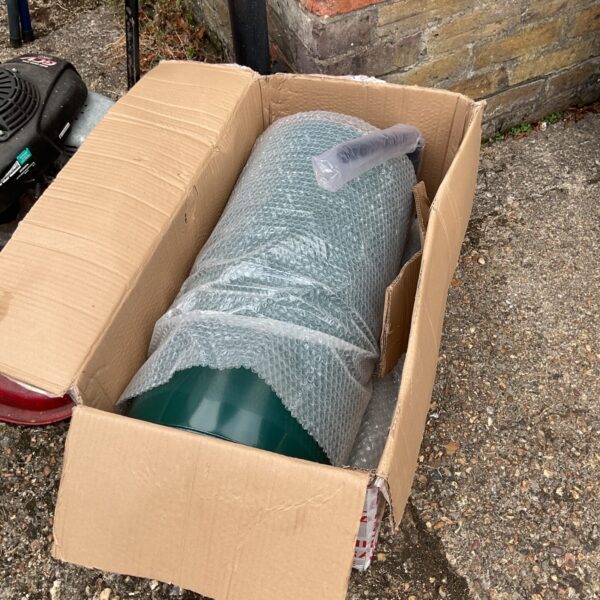 New garden roller still in its original cardboard box.