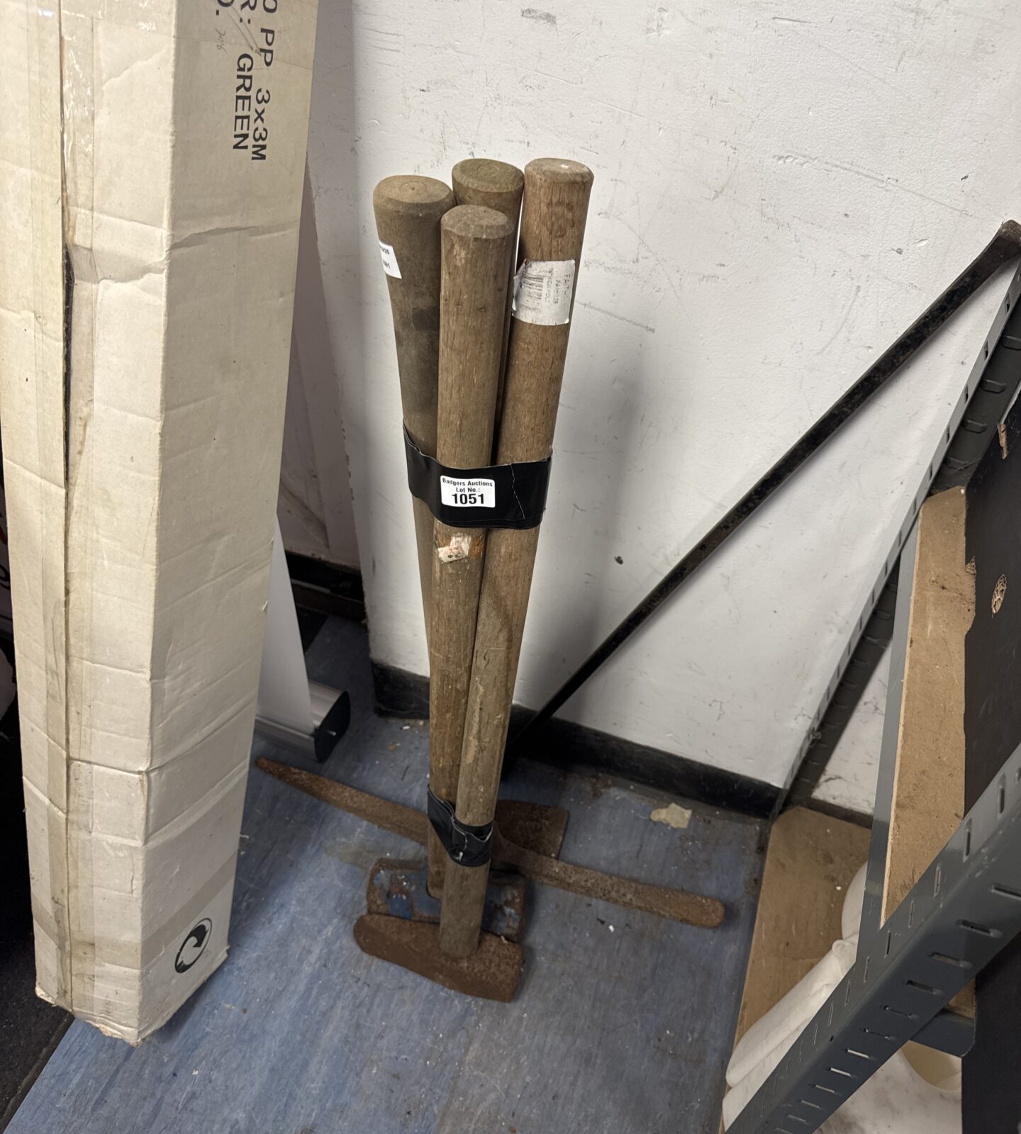 Vintage garden tool bundle including sledge hammer and axe.
