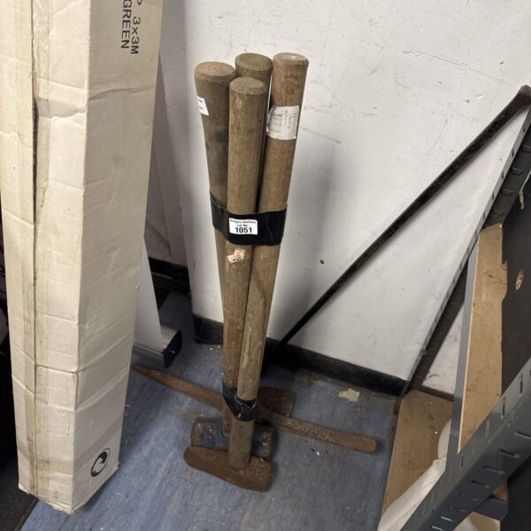 Vintage garden tool bundle including sledge hammer and axe.