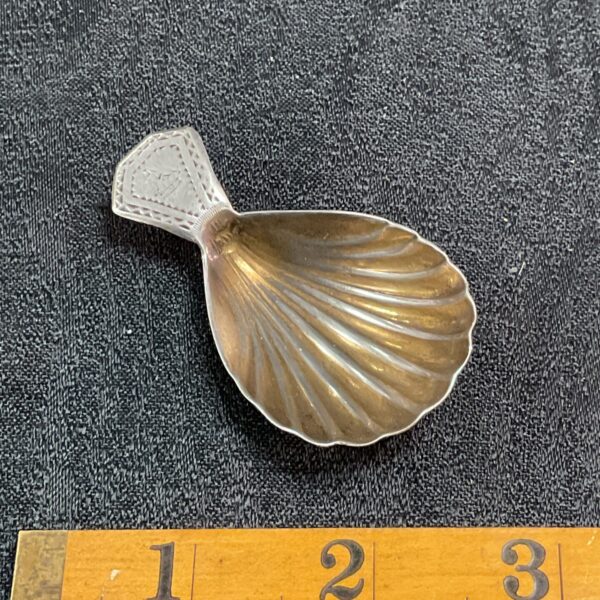 Antique Georgian silver caddy spoon with hallmarked silver.