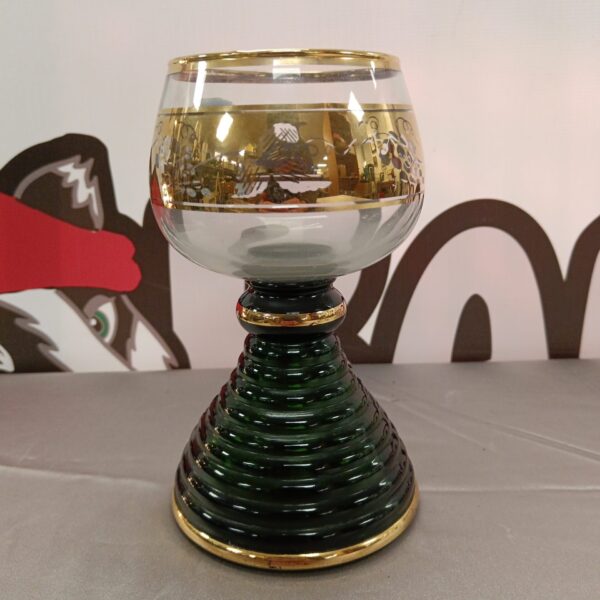 Vintage German musical goblet with green glass and intricate detailing.